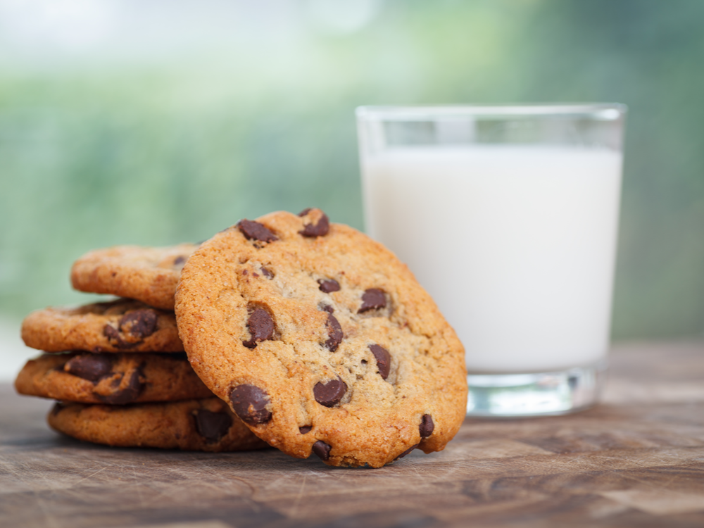 Stack of Chocolate chip cookie and glass of milk