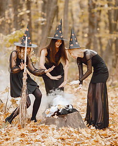 three-girls-witches-forest-halloween-girls-wearing-black-dresses-cone-hats-witches-make-ma