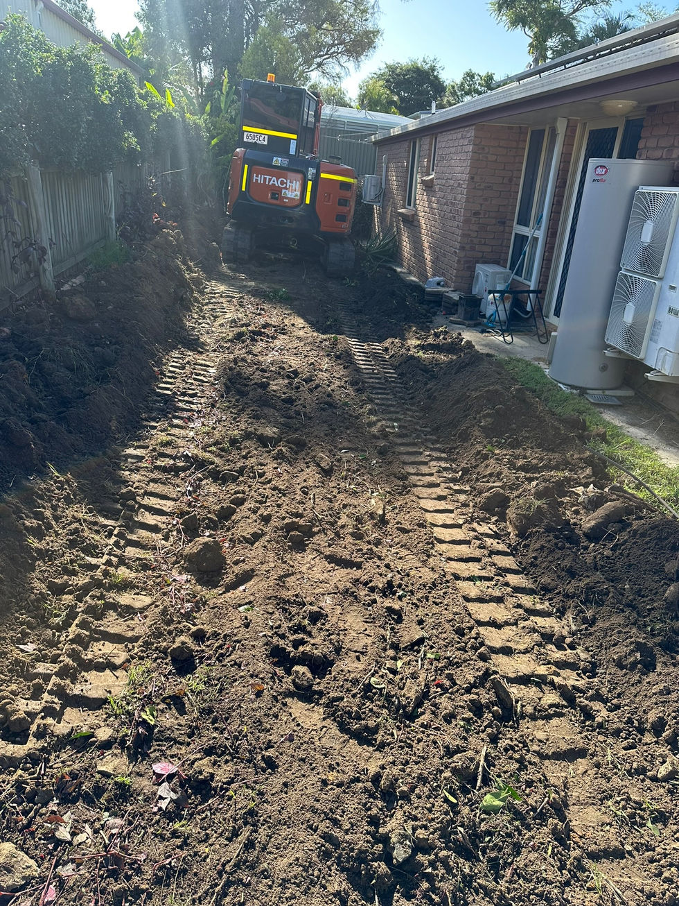 Site preparation with excavator tracks and digger
