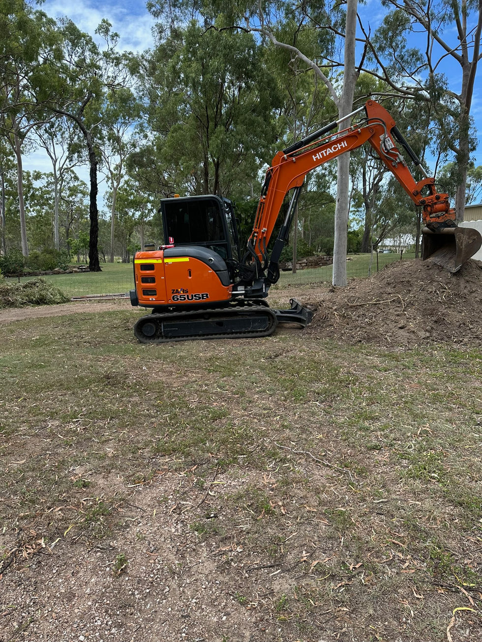 Mini excavator digging for site preparation