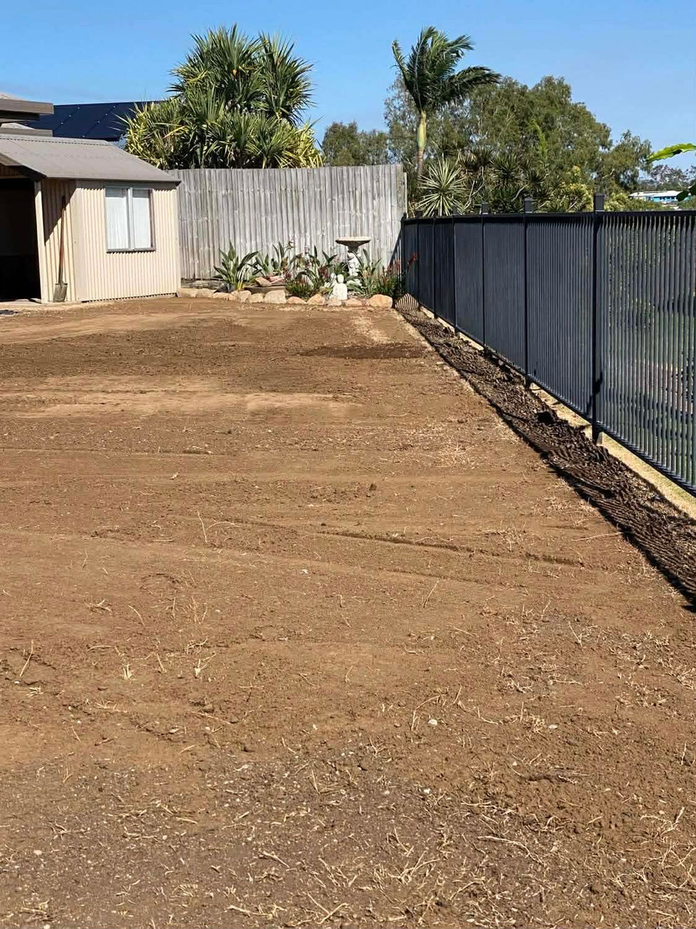 Backyard with prepared soil for turfing