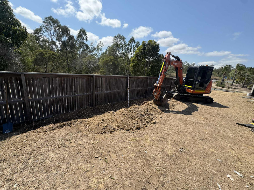Excavator digging a trench for site preparation