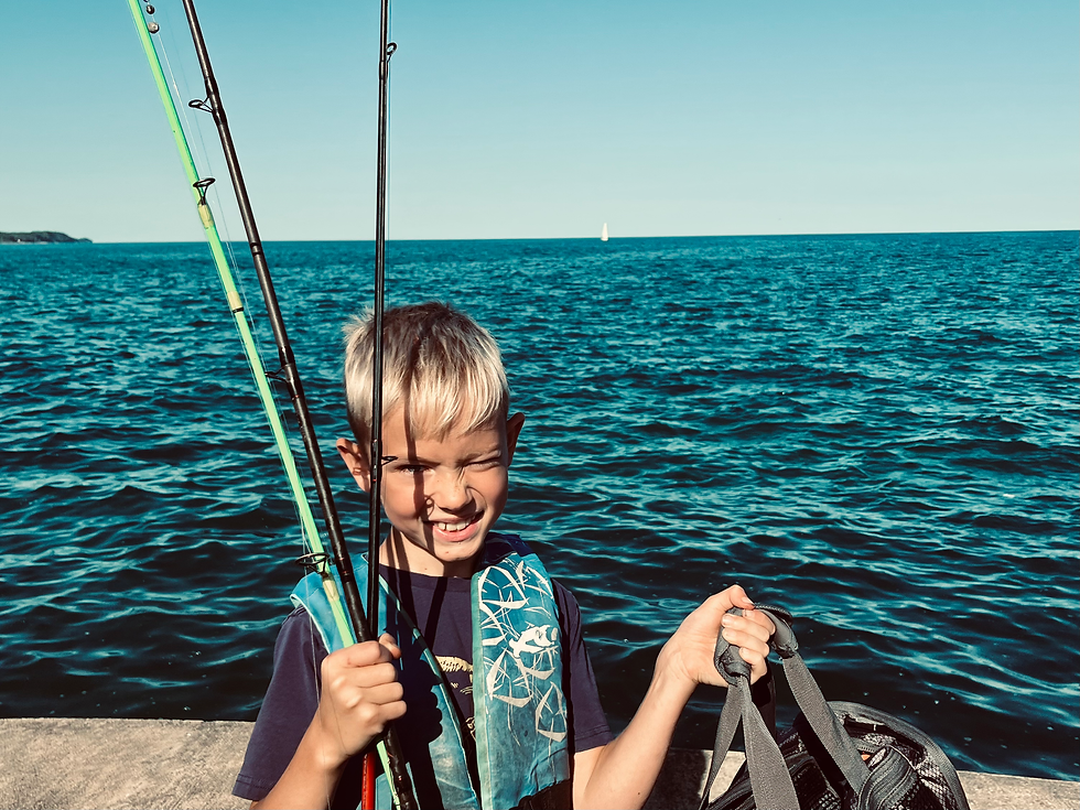 August, 2025, Kewaunee County, Wisconsin. A boy with the day's catch. Image: Frank Fu | R.M.E.