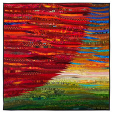 An original art quilt with the sun pieced with many shades of red against the open landscape behind.