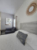 Beach-themed Studio Apartment Bed and Seating Area