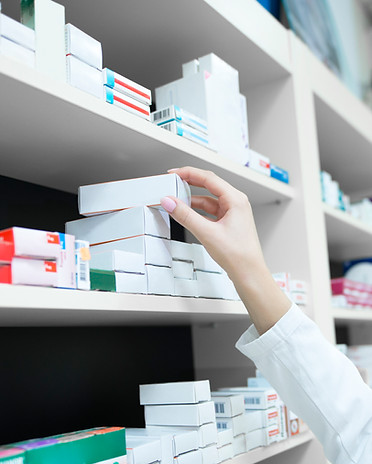 closeup-view-pharmacist-hand-taking-medicine-box-from-shelf-drug-store.jpg