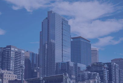 Modern skyscrapers in a city under a blu