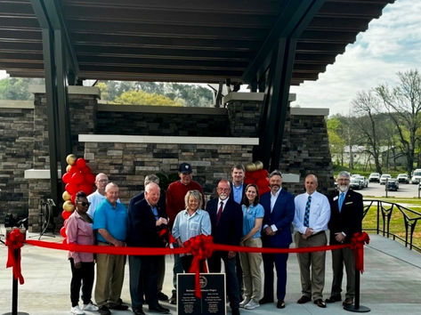 Ribbon-cutting ceremony at Rockmart Amphitheater with community leaders and project team celebrating project completion