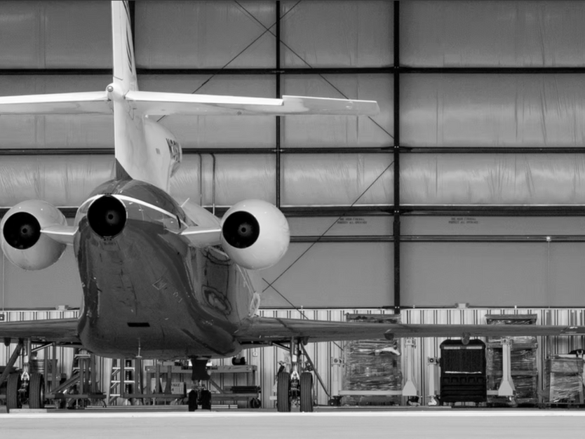 Modern aircraft hangar constructed by Headley Construction at Newnan-Coweta County Airport, featuring a large jet inside a purpose-built aviation facility designed for efficient aircraft storage and operations.