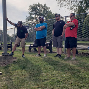 A group of guys talking outside