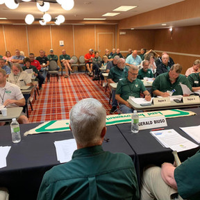 Group of people in a large meeting