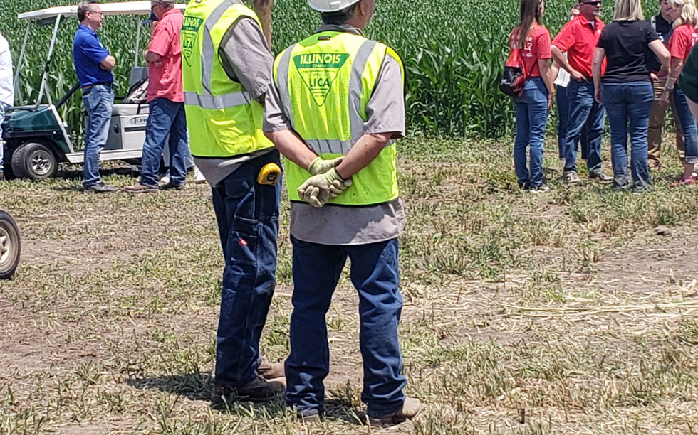 2 men in yellow safety vests