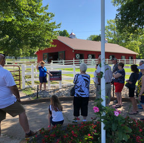 Group of people near a barn