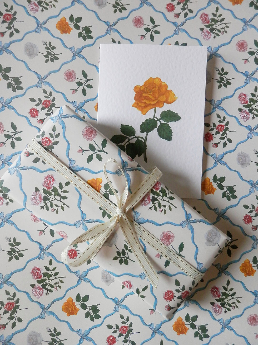 Thumbnail: All about roses, wrapping paper with mutlicoloured roses