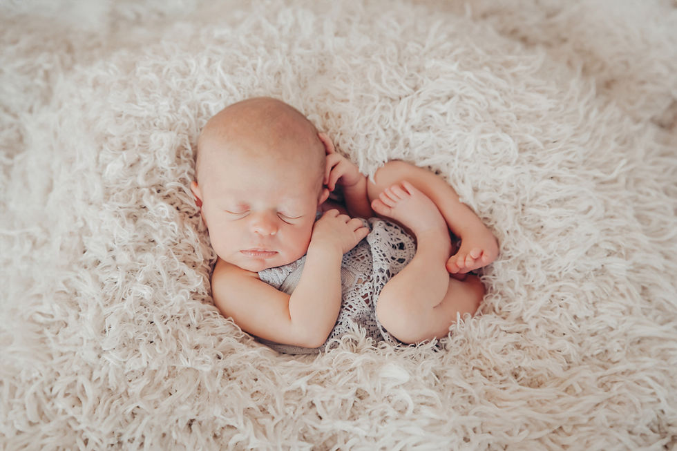 Sleeping newborn during a book photography session