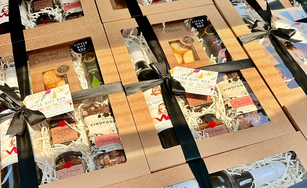 Eye-level view of a neatly wrapped corporate gift box on a wooden table