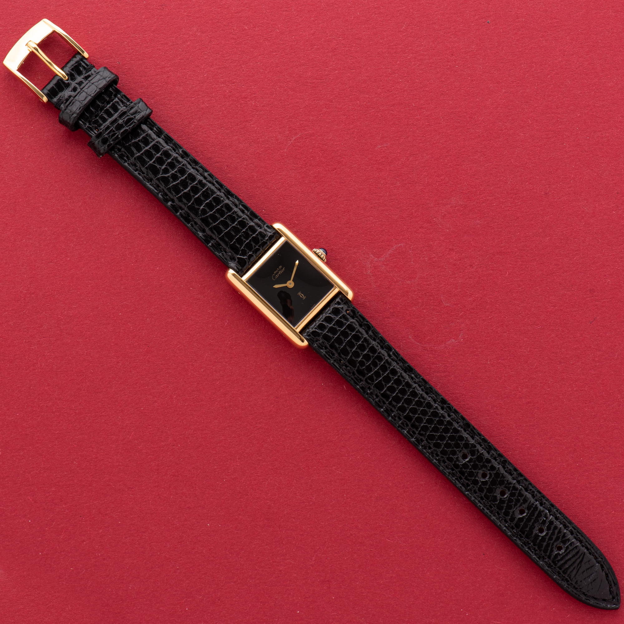 View of Cartier Must de Tank de Must Vermeil PM Onyx Black Spider Dial