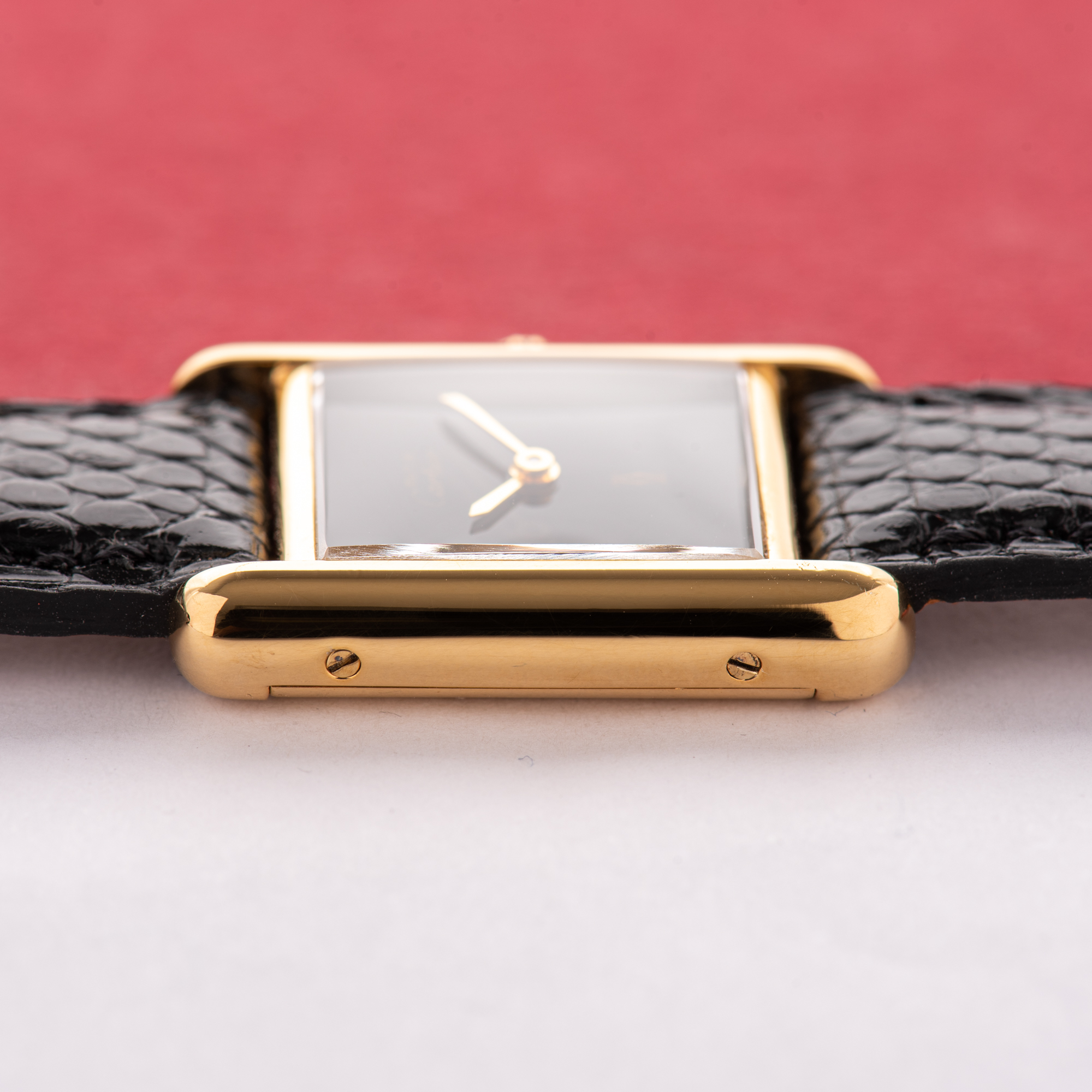 View of Cartier Must de Tank de Must Vermeil PM Onyx Black Spider Dial