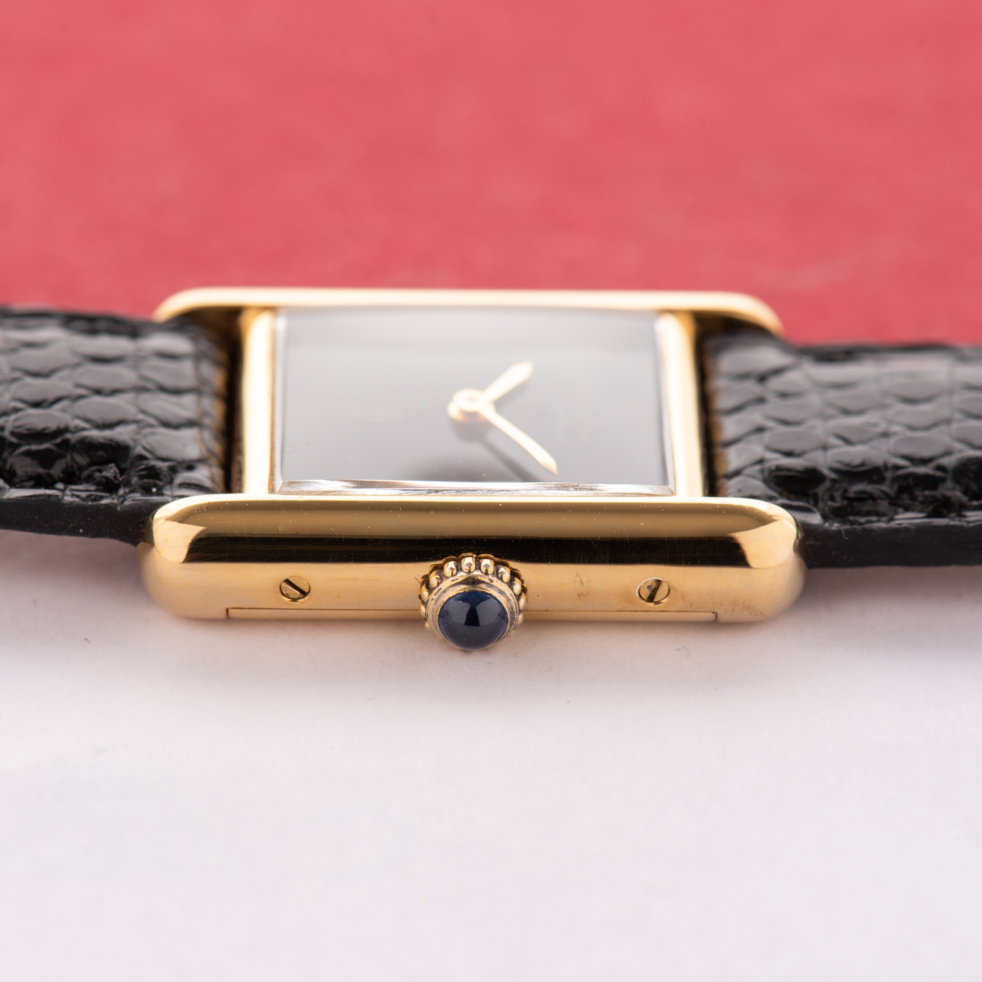 View of Cartier Must de Tank de Must Vermeil PM Onyx Black Spider Dial