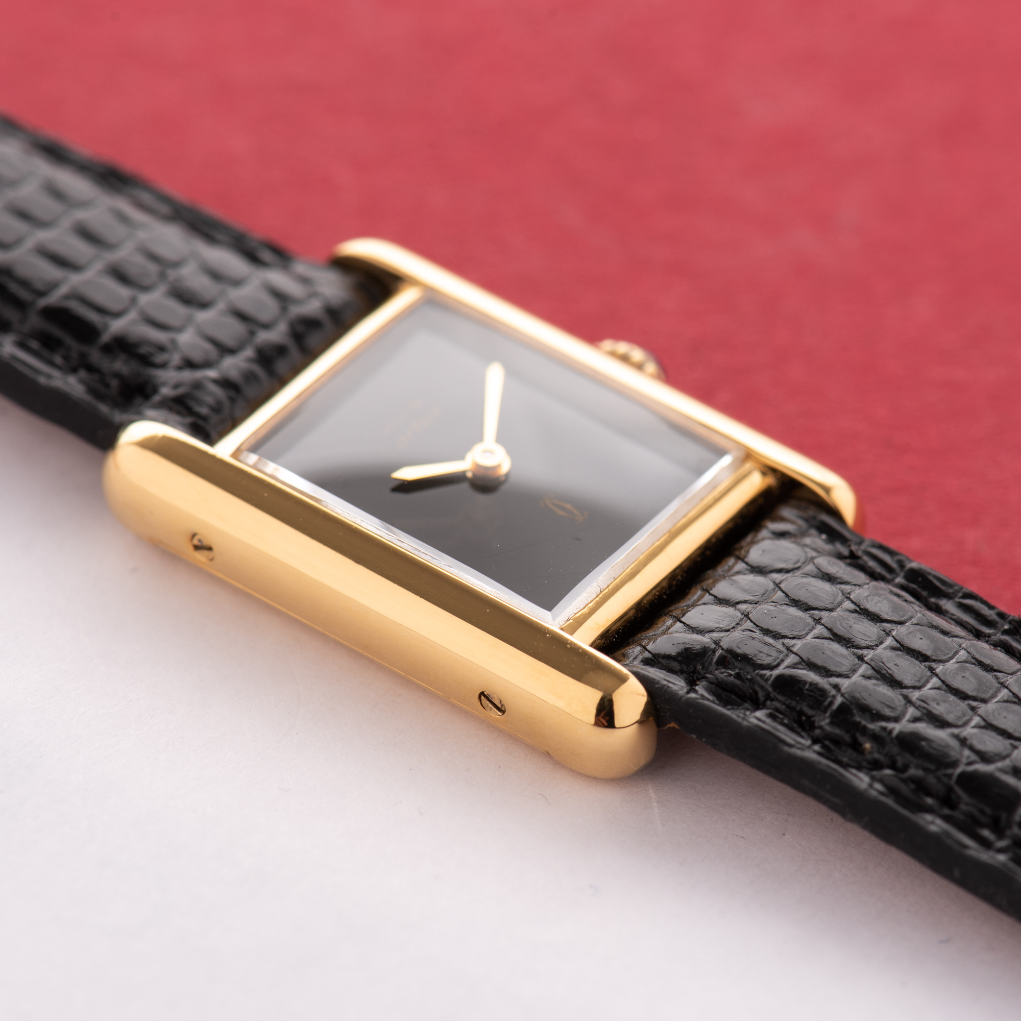 View of Cartier Must de Tank de Must Vermeil PM Onyx Black Spider Dial