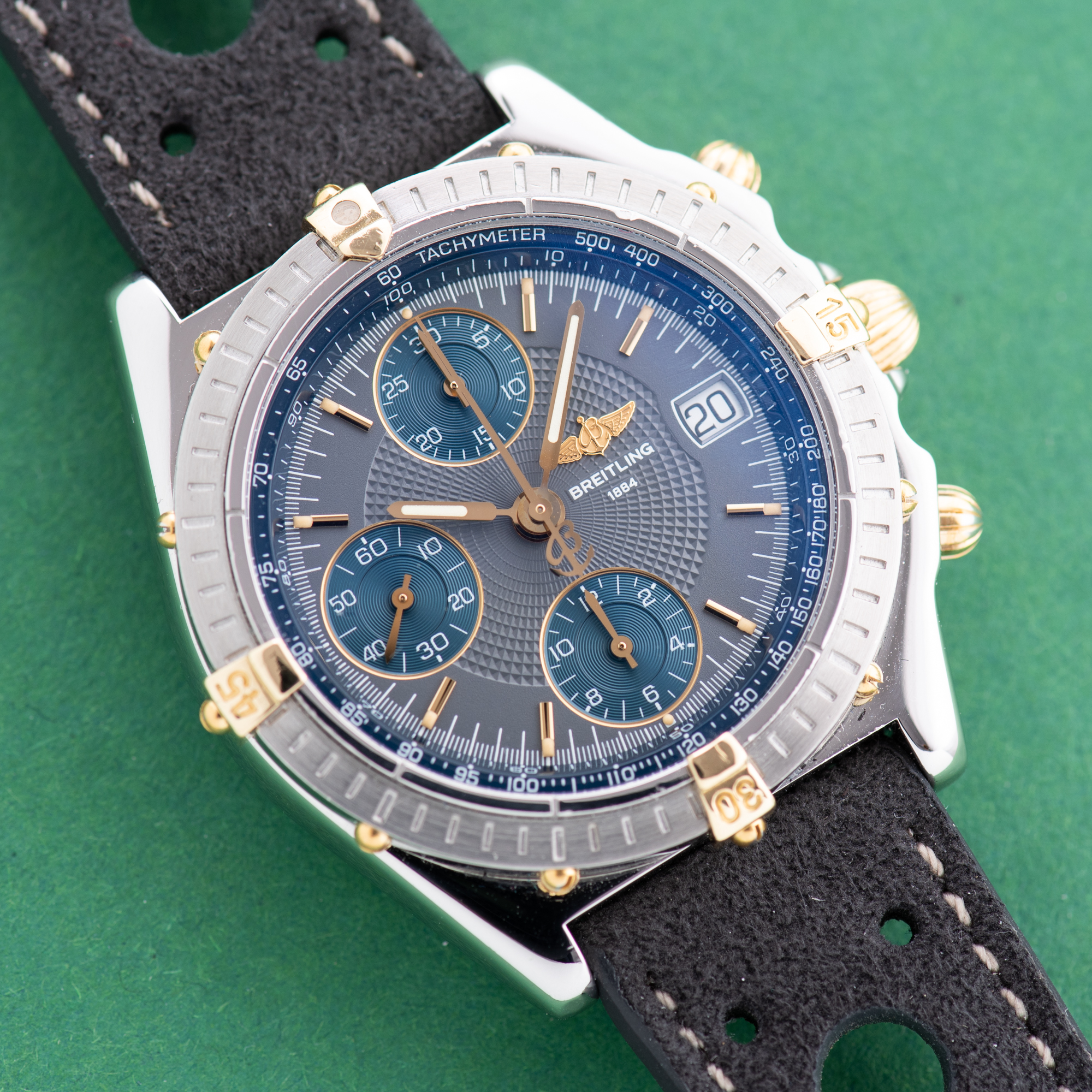 Zicht op Breitling Chronomat Gold/Staal Chronograph Grey / Blue dial Ref 13050.1