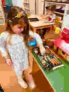 Girl selecting animal from the farm
