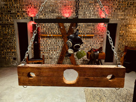 Wooden rack and gas mask in BDSM room