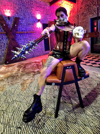 Adult playroom discipline photography with person, mace, skull
