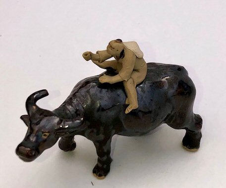 Ceramic Figure Man Ridding on Buffalo