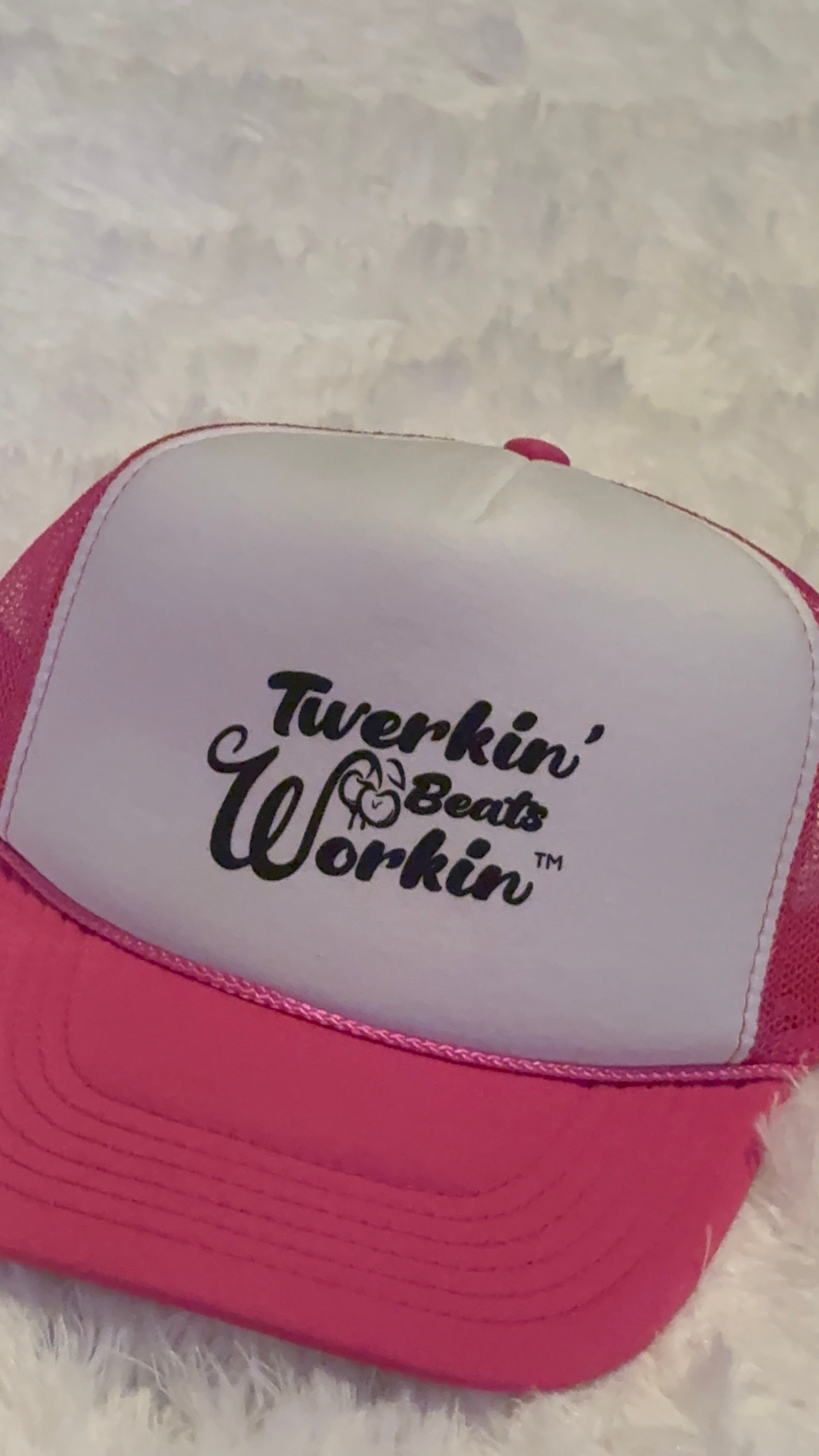 Pink and white hat with Twerkin’ Beats workin’ peach design in black