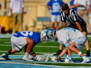 football players on field during daytime