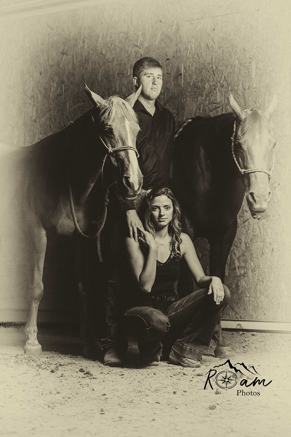 Man and woman standing with their horses