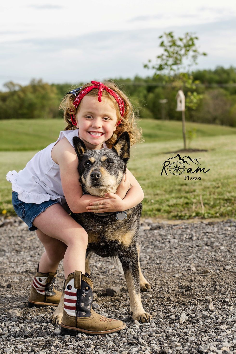 Little girl hugging her dog.
