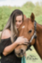 Beautiful woman hugging her horse