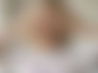 A woman hiding her face from the camera