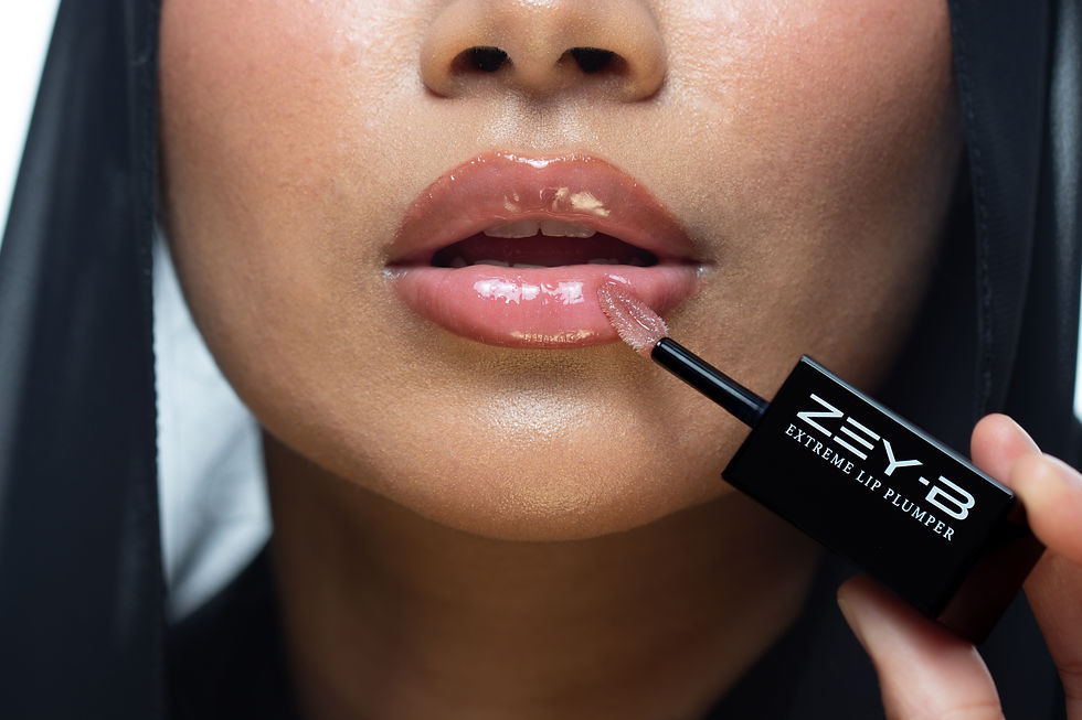 woman applying ZEY-B extreme lip plumper gloss