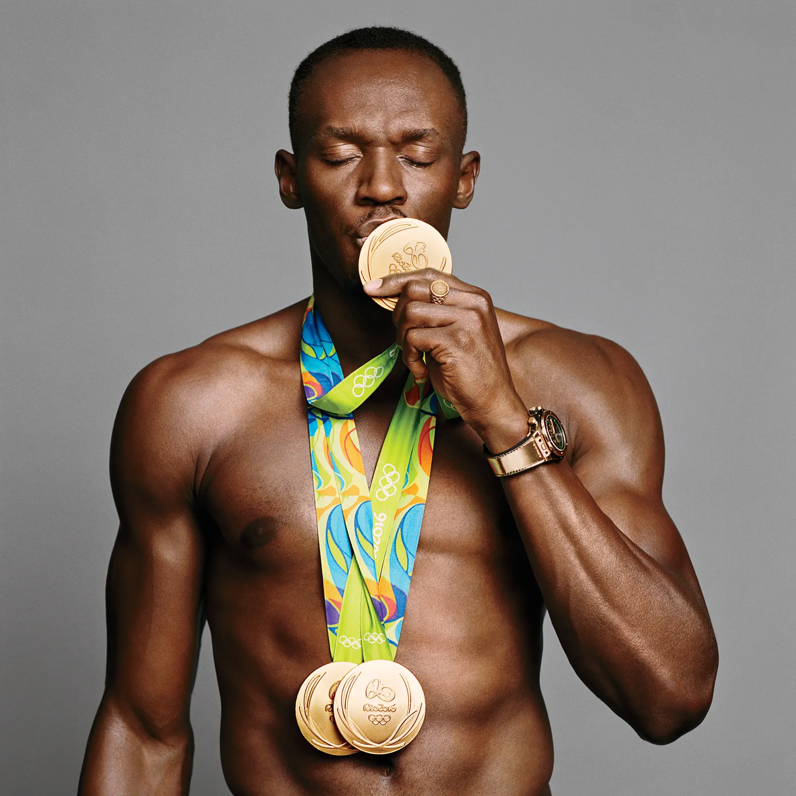 Usain Bolt with Olympic Gold Medals