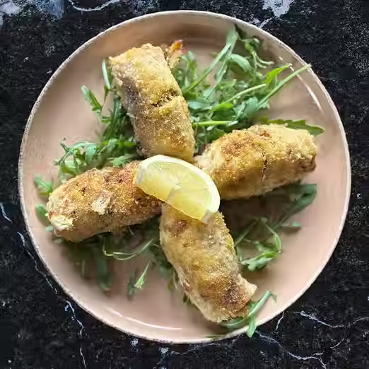 Swordfish rolls filled with , a Sicilian delight filled with lemon, raisins and pine nuts
