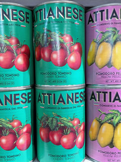 Cans of red and yellow cherry tomato passata