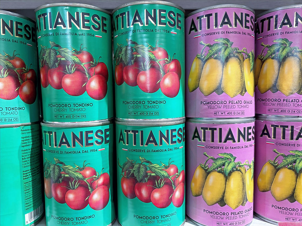 Cans of canned red and yellow cherry tomatoes