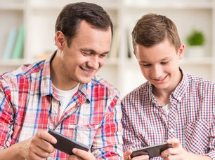 Parent and teen researching cars
