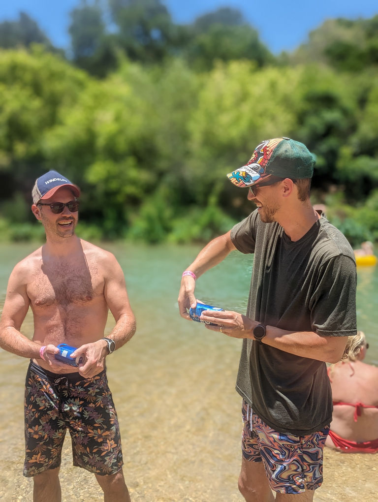 Two friends about to shotgun a beer