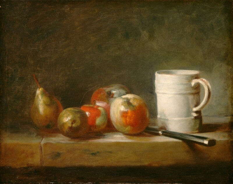 Fruit, a knife, and a white mug arranged on a stone surface.