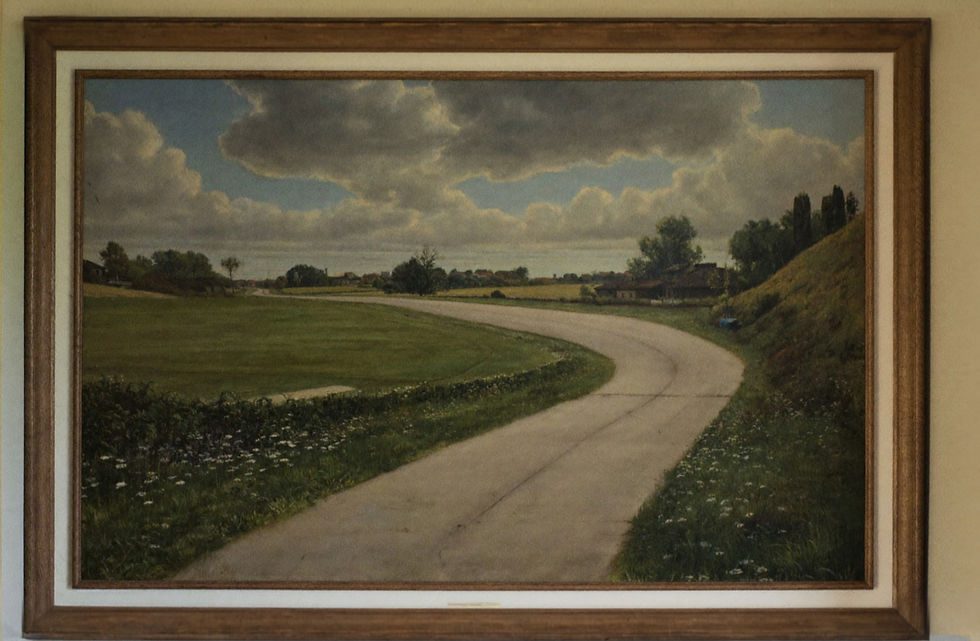 Countryside path painting creating visual distance in a warm plaster entryway.