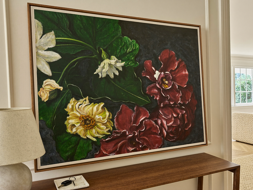 Floral still-life housewarming artwork installed above a walnut entryway console.