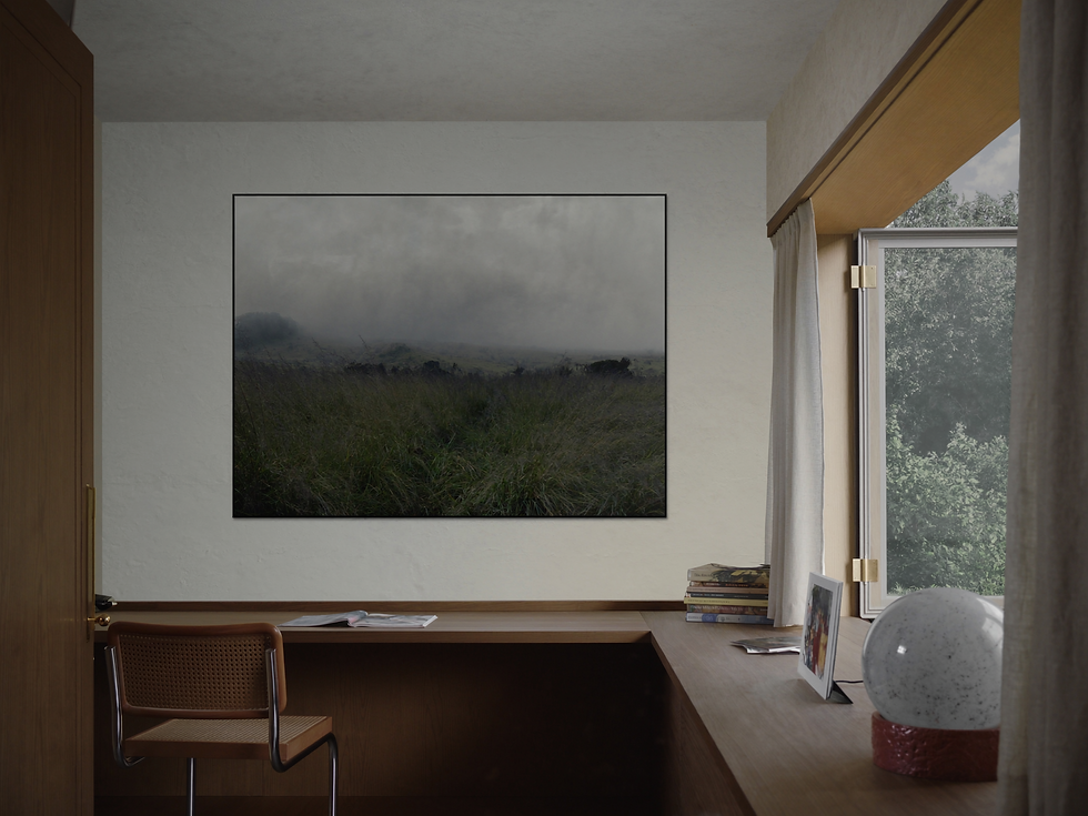Calm architect-designed home studio with framed misty meadow art, oak desk, and garden-filtered daylight.