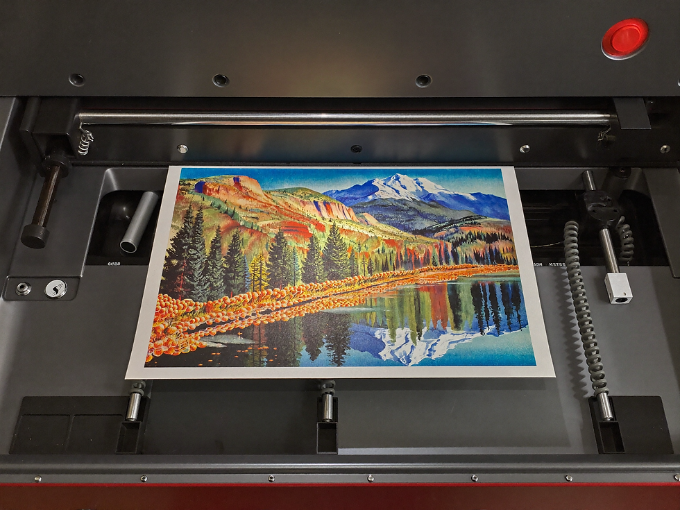 Colorful landscape artwork emerging from a large print machine