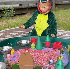Child playing in tuff tray