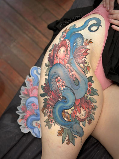 Colour Neotraditional Snake Tattoo on the thigh with Australian Native flowers