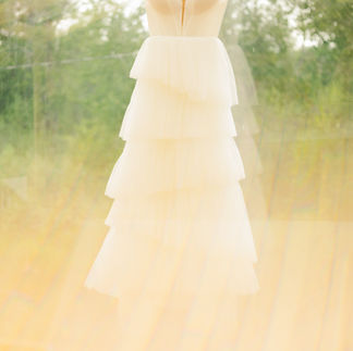 Photo of a brides dreen glowing in orange haze